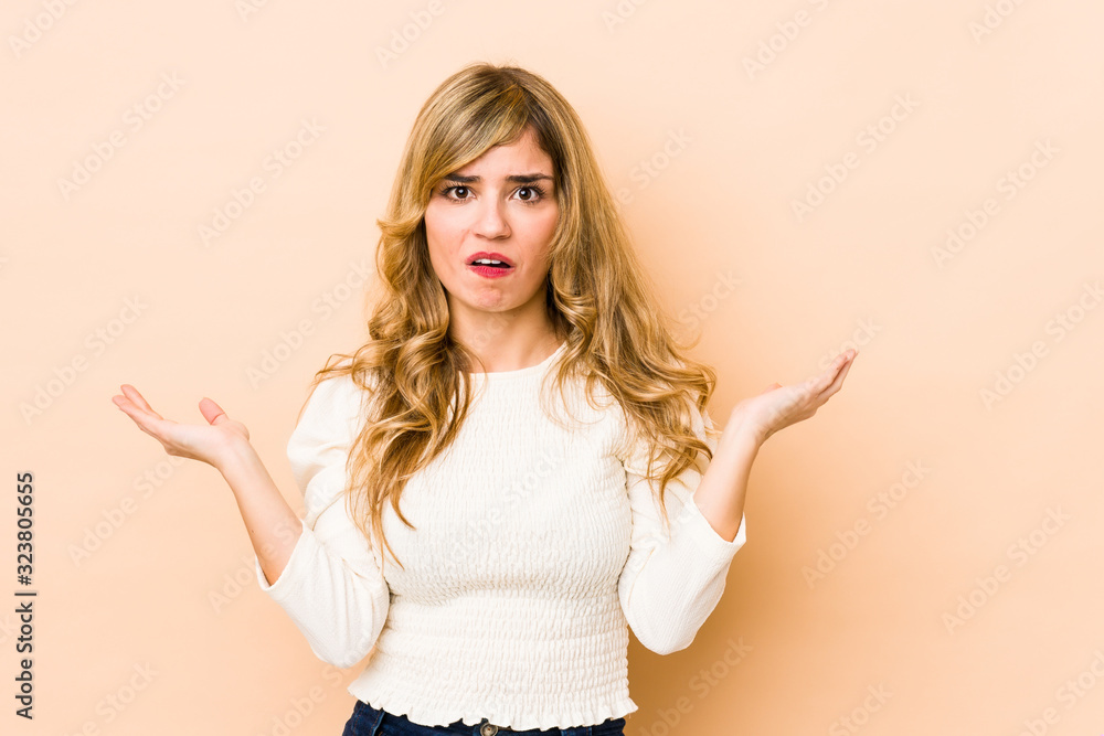 Young blonde caucasian woman surprised and shocked. Young blonde caucasian woman surprised and shocked.