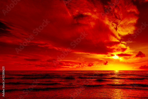 Fototapeta Naklejka Na Ścianę i Meble -  Bright red sunset over the sea. All in red.