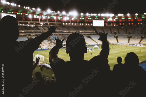 Football, soccer fan support their team and celebrate goal, score, victory. Black silhouette.