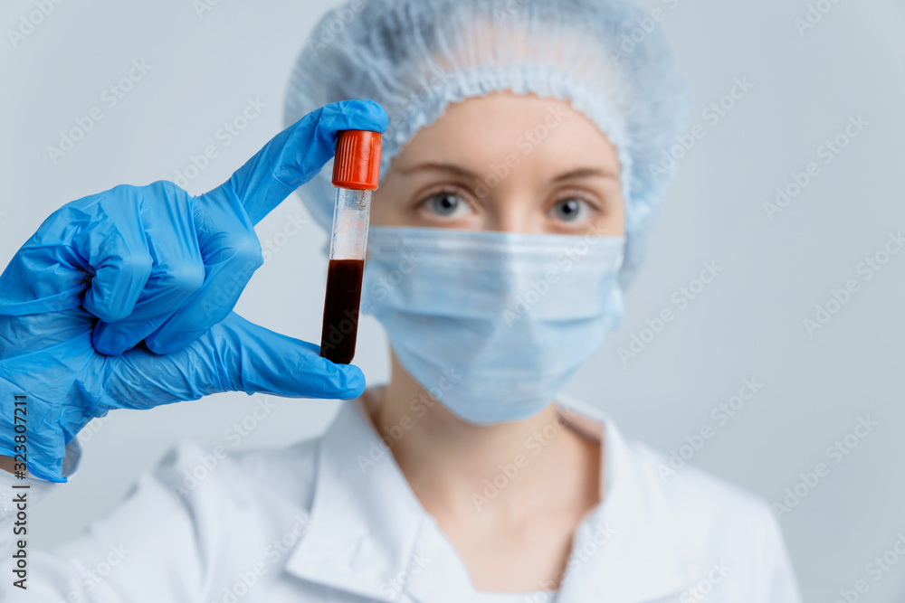 Doctor holds test tube with blood sample for Coronavirus testing. Respiratory Syndrome, Wuhan, China. 2019-nCoV. Doctor holds test tube with blood sample for Coronavirus testing. Respiratory Syndrome, Wuhan, China. 2019-nCoV.