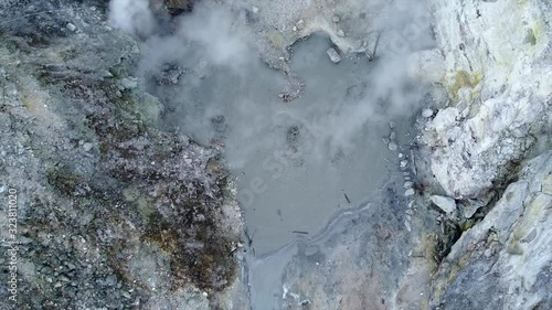 Aerial view of Volcanic Activity Boiling Geothermal Mud Pot In Crater Of Active Volcano photo