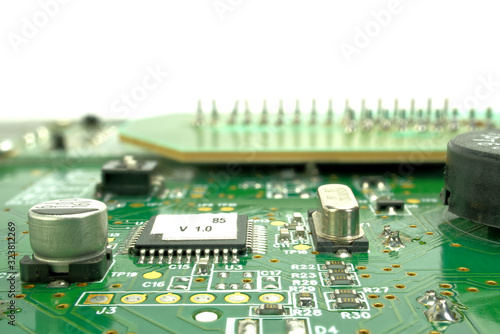 Electronic board can be used as background . Close up of a printed green computer circuit board photo