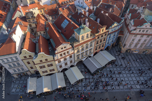 Photography Aerial view of Prague's old town square and roofs of old ancient buildings