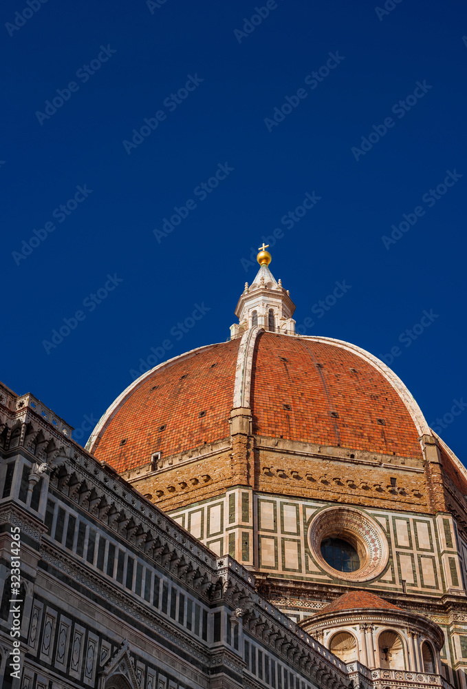 St Mary of the Flower iconic dome in Florence seen from below, built by italian architect Brunelleschi in the 15th century and symbol of Renaissance in the world (with copy space above)
