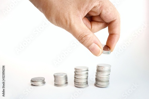 hand with coins isolated on white background.
