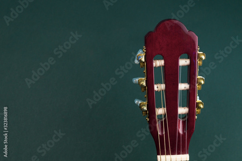 Fotografie Guitar headstock close up. acoustic musical instrument