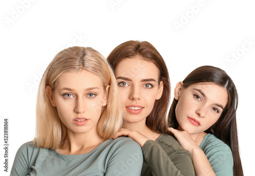 Young women with beautiful makeup on white background