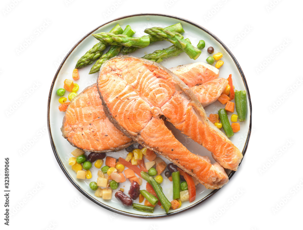 Plate with fried salmon and vegetables on white background Plate with fried salmon and vegetables on white background