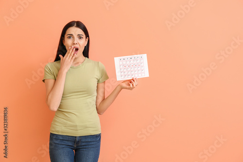 Shocked woman with menstrua...