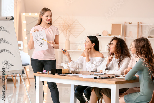 Young woman teaching studen...
