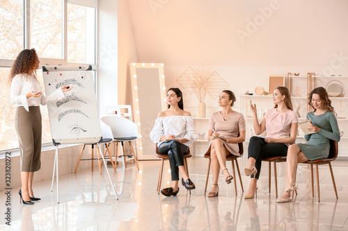 Young woman teaching studen...