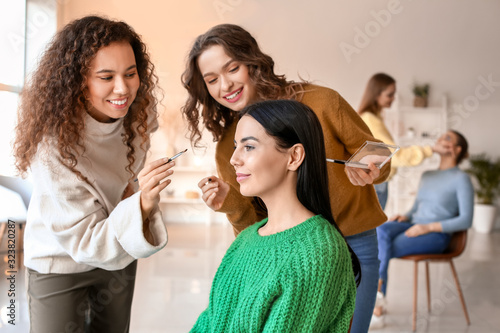 Young woman teaching studen...