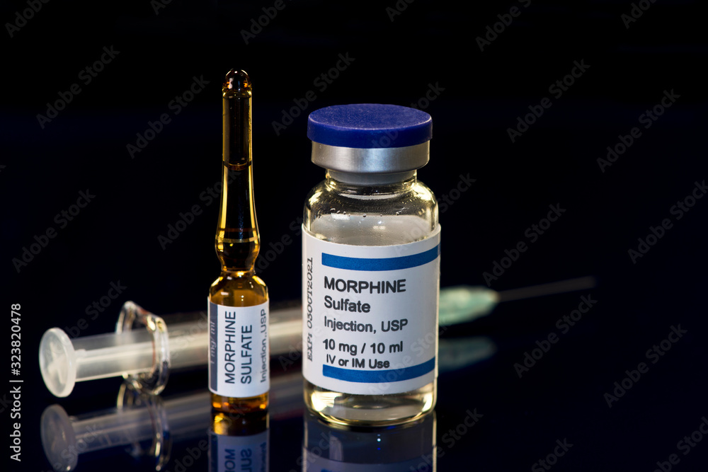 Morphine Sulfate Ampule, Vial And Syringe On Dark Surface Morphine Sulfate Ampule, Vial And Syringe On Dark Surface