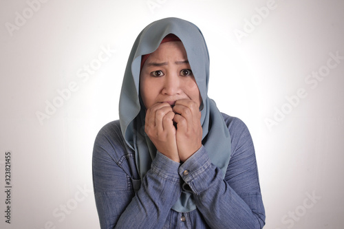 Worried Muslim Woman Biting Nails