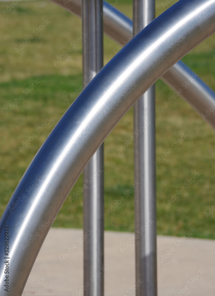 Close-up view of stainless steel tubes from a sport equipment installation in a public park
