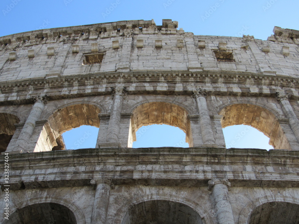 Close up of the window arches of the Colosseum, or Flavian Amphitheater, located in Rome, Italy 