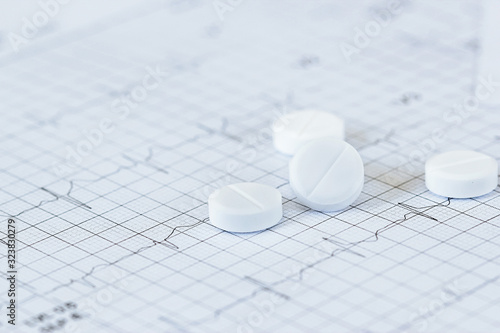 Medicine of cardiologist and nitroglycerin on heart rate checking  report paper's patient diagnosising of doctor on table work. photo