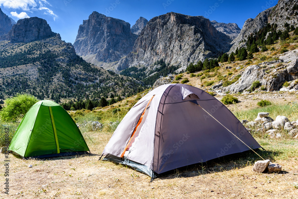 Mountain landscape with trees and two tents in the Turkish national Park aladag in summer day