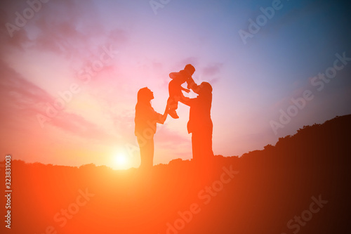 silhouette of parent play with kid