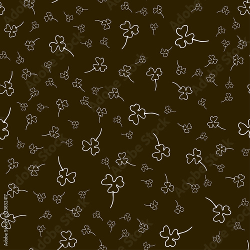 Seamless pattern with clovers for St. Patrick's Day. Three leaf clover on a green background. Outline drawing.