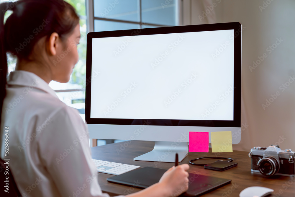 Asian women of happy smiling are using computer mockup of blank screen and working designer on the table office. Take your screen to put on advertising. Asian women of happy smiling are using computer mockup of blank screen and working designer on the table office. Take your screen to put on advertising.