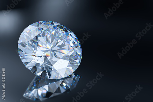 Round cut diamond on gray glossy background photo