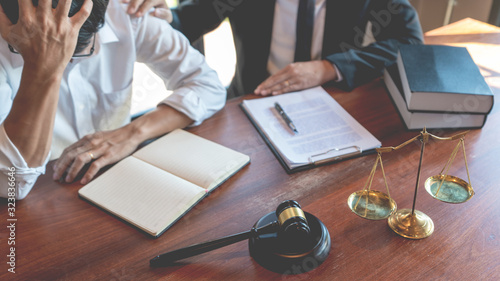 Tableau sur toile Male Notary lawyer or judge consult or discussing contract papers with Businessm