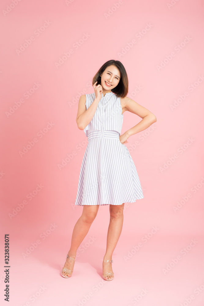 Full length photo of cheerful positive girl have fun on summer party event dance raise fingers up wear casual style clothing isolated over pink background Full length photo of cheerful positive girl have fun on summer party event dance raise fingers up wear casual style clothing isolated over pink background