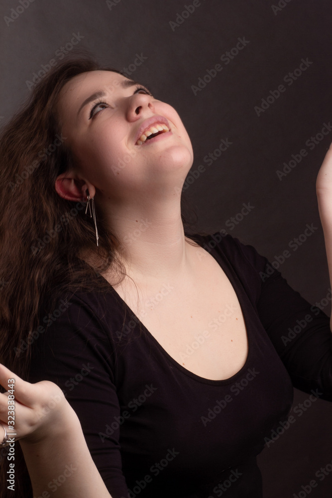 portrait of a brunette with long curly hair portrait of a brunette with long curly hair