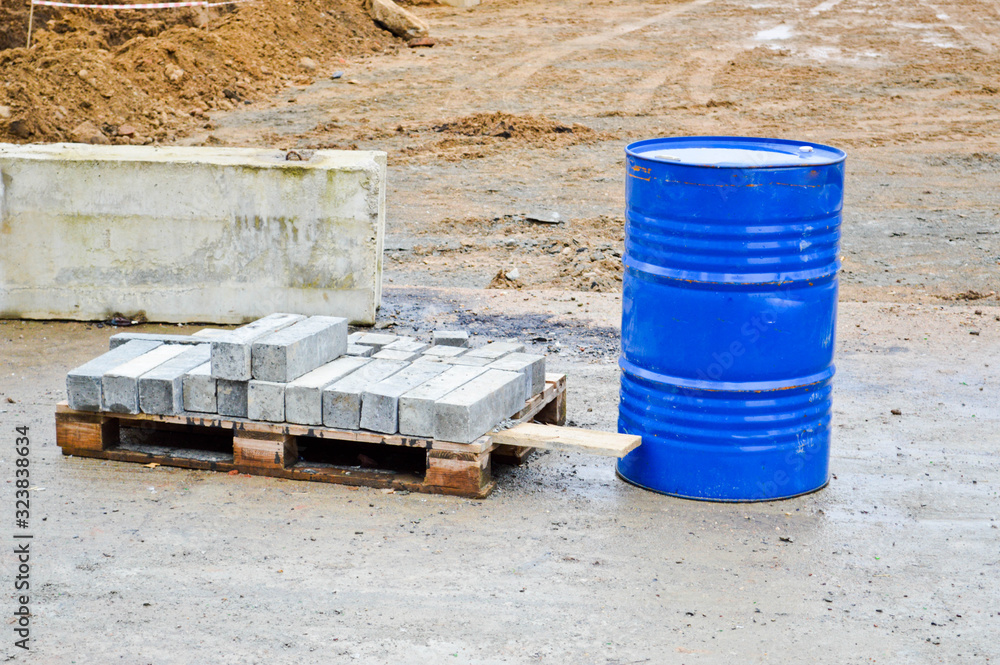 Large metal iron industrial blue round 200 liter barrel for storing gasoline and diesel fuel, liquid Large metal iron industrial blue round 200 liter barrel for storing gasoline and diesel fuel, liquid
