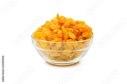 Obraz na plátně heap of golden sultana raisins in a glass bowl isolated on white background
