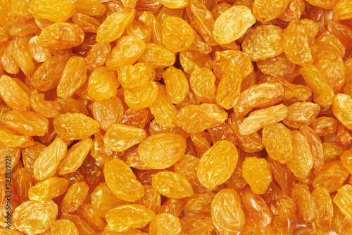 closeup of golden sultana raisins photo