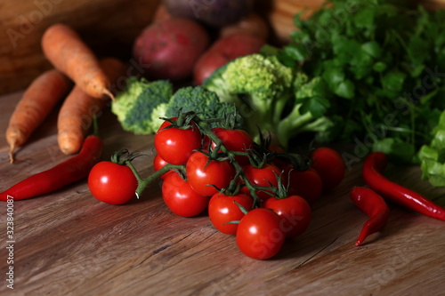 fresh vegetables for cooking on a structural wooden table