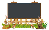 Blackboard template design with many rabbits in the garden