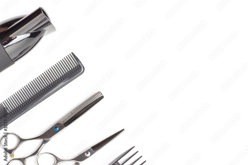 Hairdressing tools and hairdryer on white background, top view, copy space. Hairdressing tools and hairdryer on white background, top view, copy space.