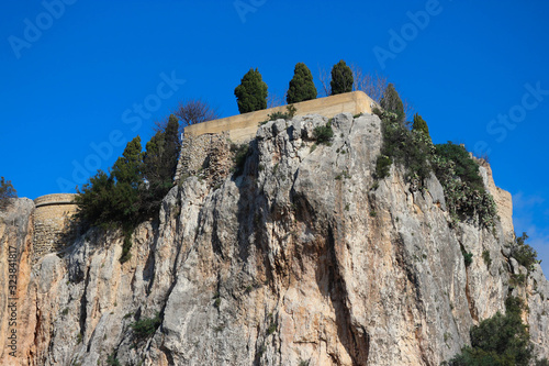 View to San Jose Castle in Castell de Guadalest under clear blue sky photo