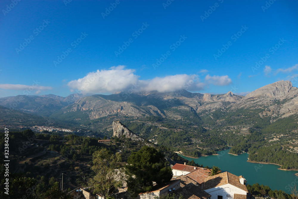 View of the Guadalest reservoir lake with azure water from the castle, Castell de Guadalest, Spain