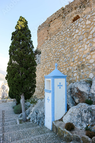 ruins of old castle in Castell de Guadalest with stations of the cross, Spain photo