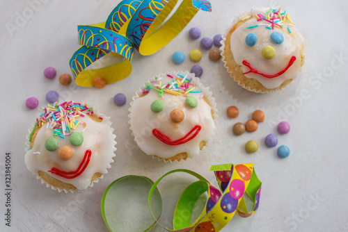 carnival clown muffins decorated with multi colored chocolate lentils