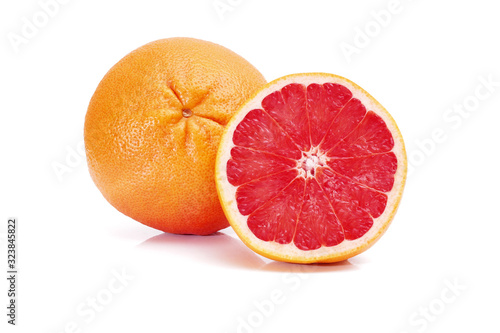 ripe grapefruit and half isolated on white background