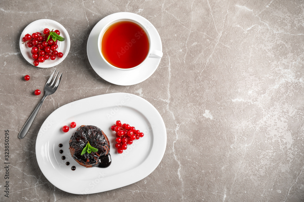 Delicious warm chocolate lava cake on marble table, flat lay. Space for text Delicious warm chocolate lava cake on marble table, flat lay. Space for text