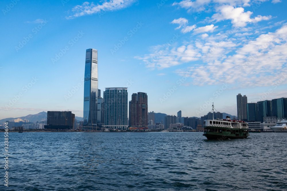 Naklejka premium Hong Kong cityscape, Victoria harbour. The ferry is floating on the water