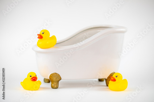 Rubber duck in the bath on a white background.