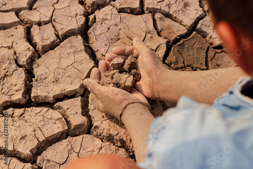 on dry ground, concept hope and drought