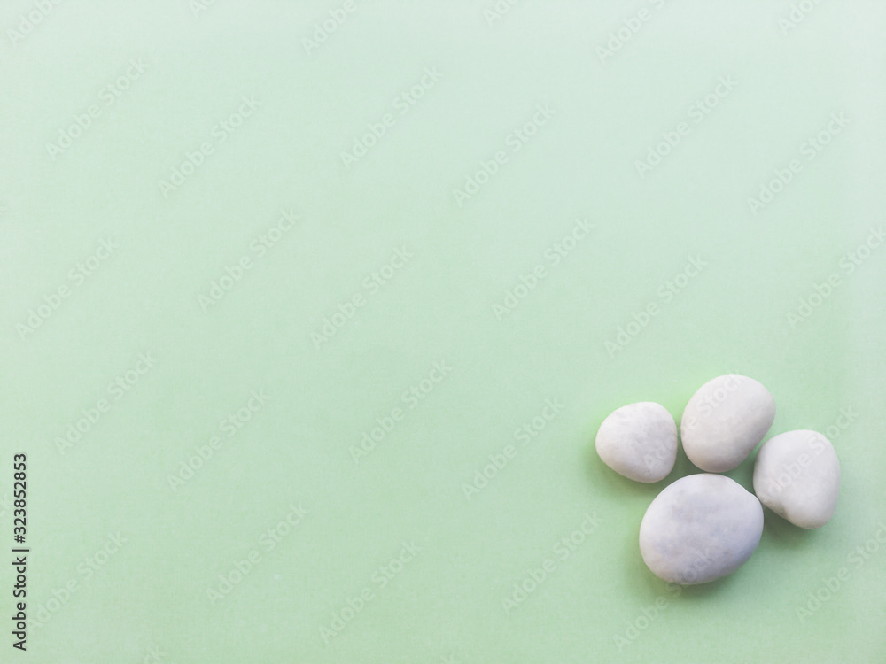 White stone spa on a green background White stone spa on a green background
