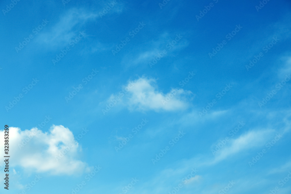 Beautiful light blue sky with fluffy clouds Beautiful light blue sky with fluffy clouds