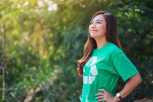 A beautiful asian woman environmental activists standing in the park photo