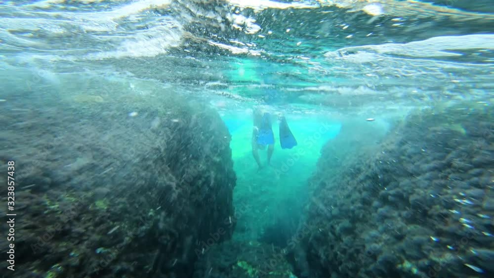 Underwater view of girl in bikini snorkeling in crystal clear sea water Underwater view of girl in bikini snorkeling in crystal clear sea water