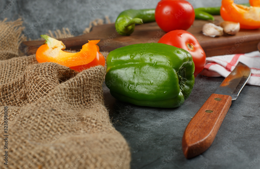 Green bell pepper on a rustic background. Green bell pepper on a rustic background.