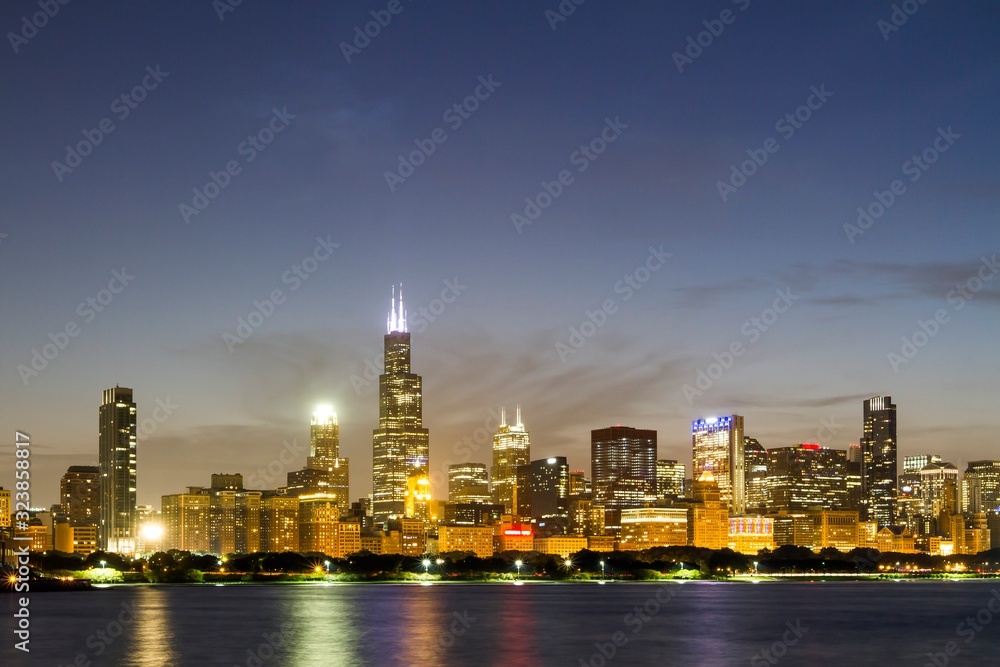 Beautiful view of Chicago skyline with waterfront at night, Illinois, USA Beautiful view of Chicago skyline with waterfront at night, Illinois, USA